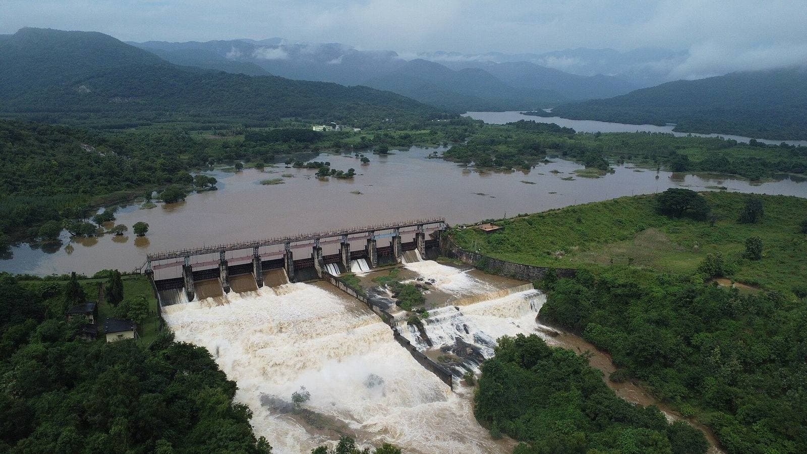 A dam and reservoir among green hills near Anakapalli