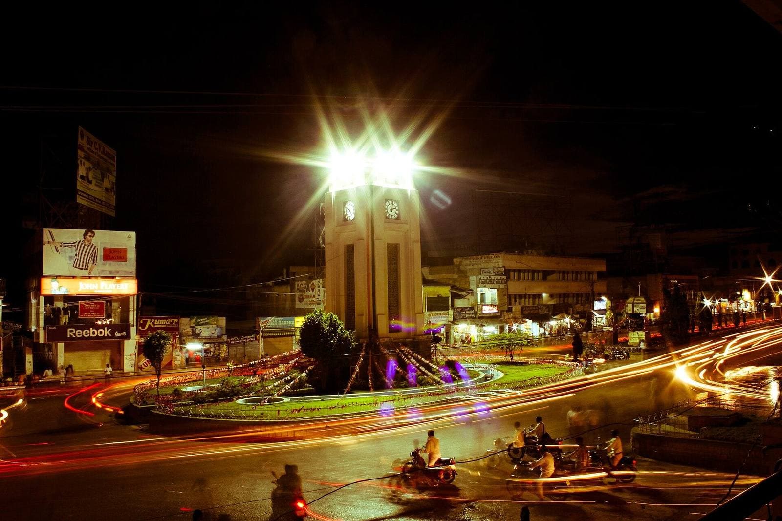 The clock tower junction in Anantapur, lit at night