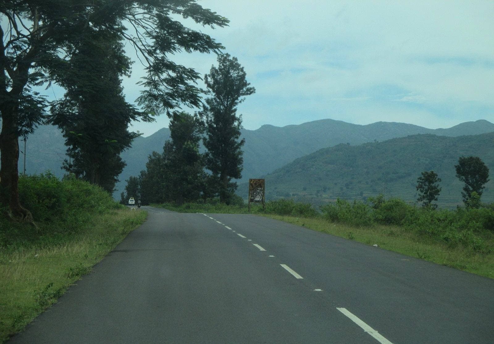 A road winding through green hills in Araku Valley