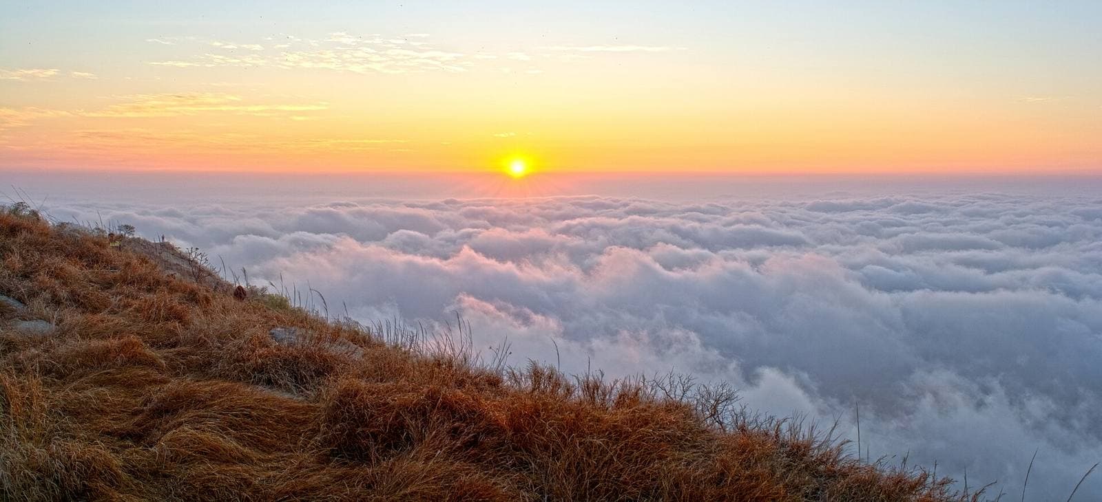 Sunrise above a sea of clouds at Nandi Hills, near Chikkaballapur