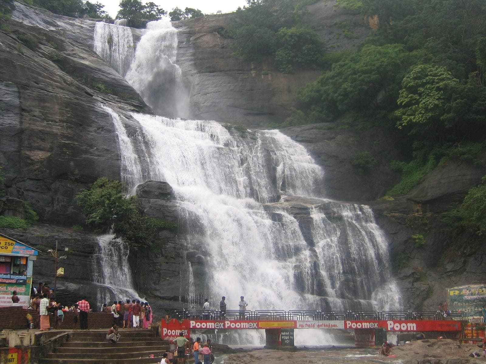 Visitors at the foot of the Main Falls, Courtallam