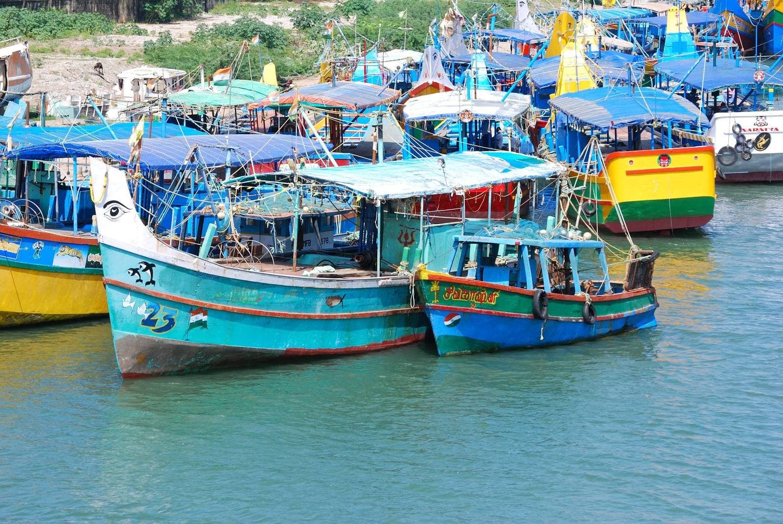Brightly painted fishing boats moored at Cuddalore harbour