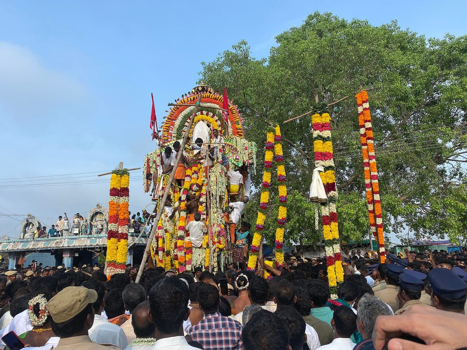 A flower-decked chariot among the festival crowd at the Koothandavar Temple, Koovagam