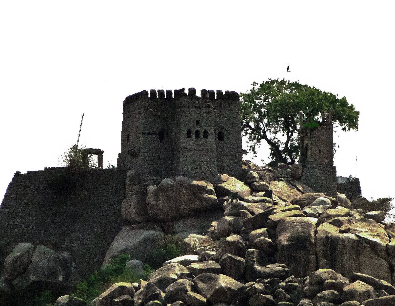 The stone walls of Raichur Fort on a rocky outcrop