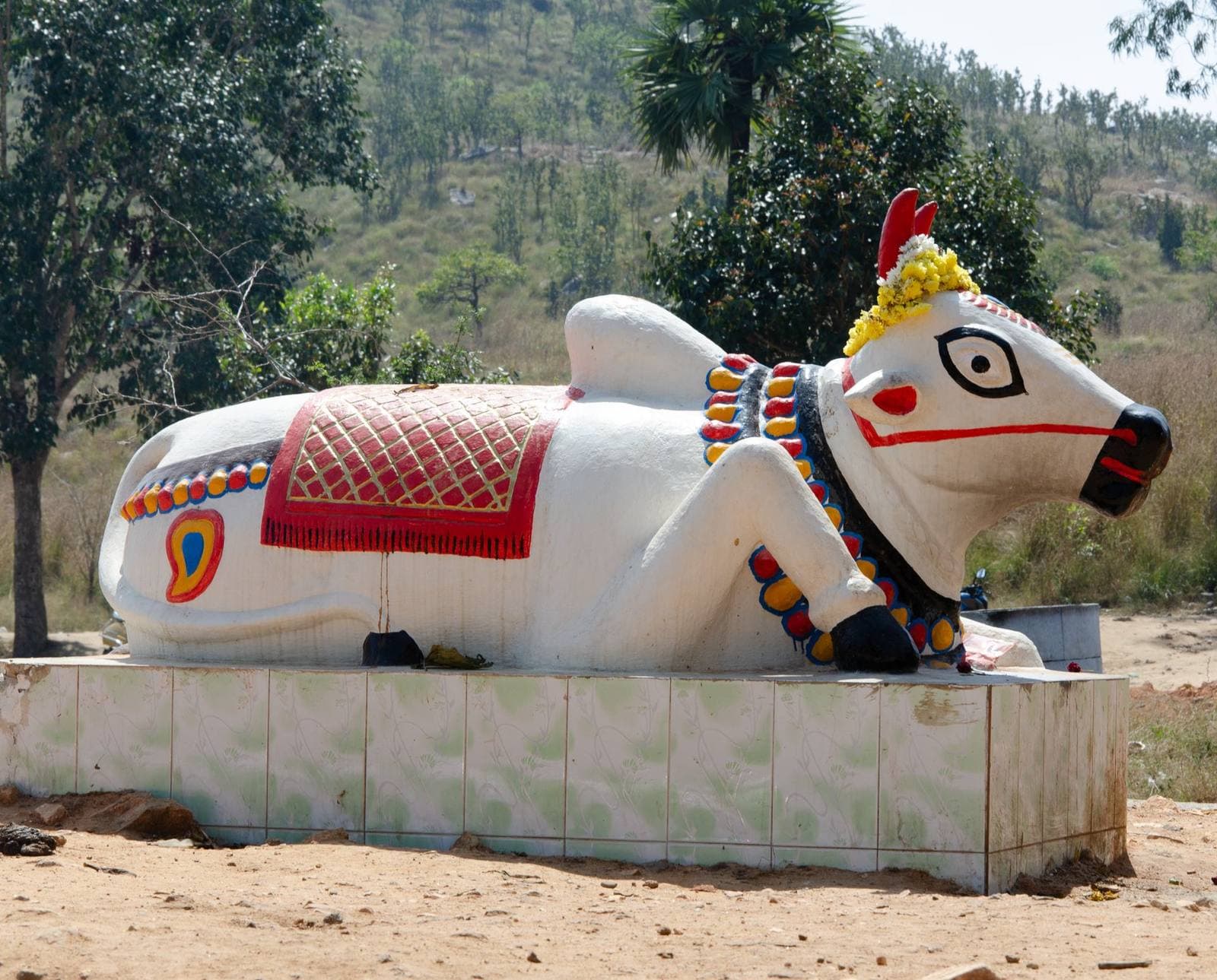 A painted Nandi statue by the roadside in Ranipet