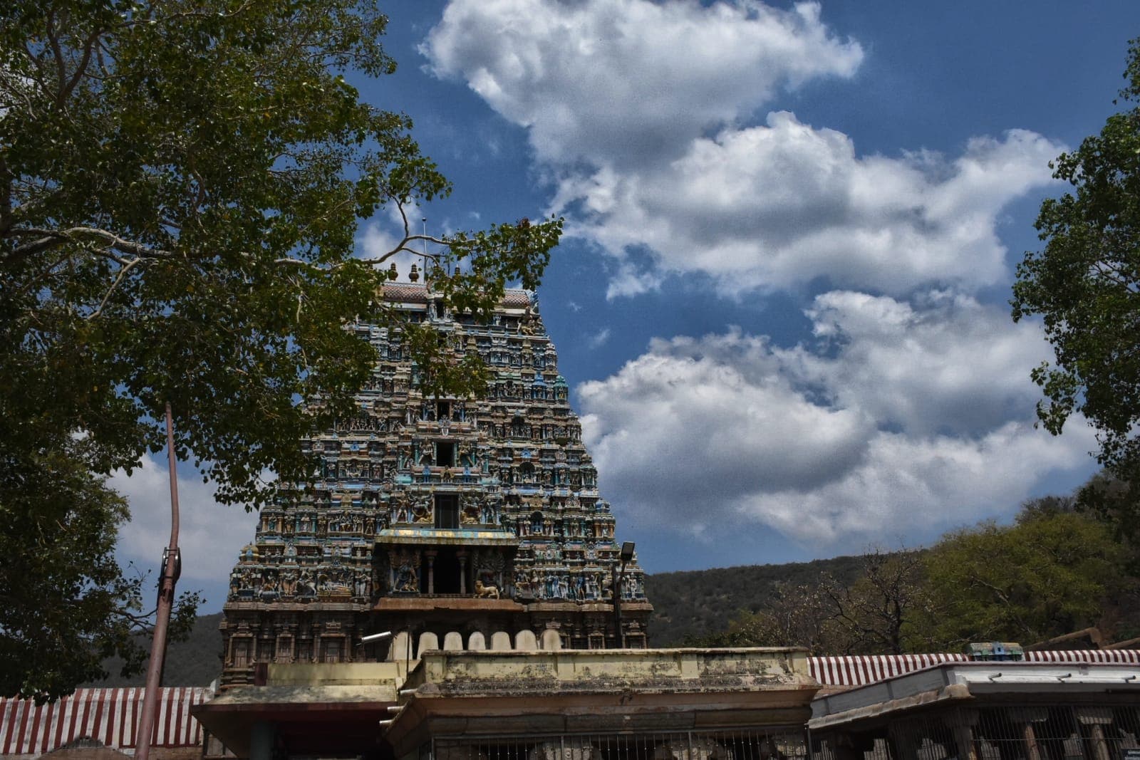 The gopuram of the Murugan temple at Thiruparankundram with the rock hill behind