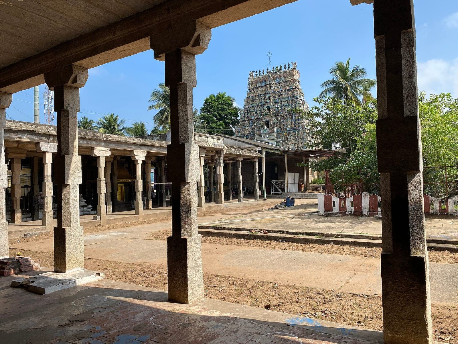 A pillared corridor and gopuram at the Mahalingeswarar Temple, Thiruvidaimarudur