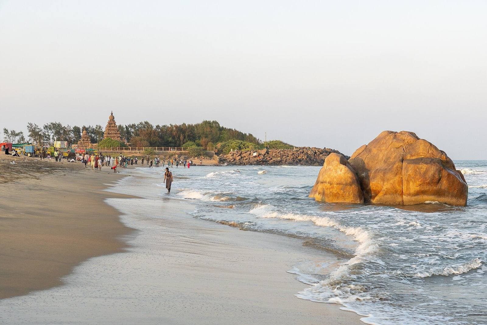 The beach at Mamallapuram with a boulder in the surf