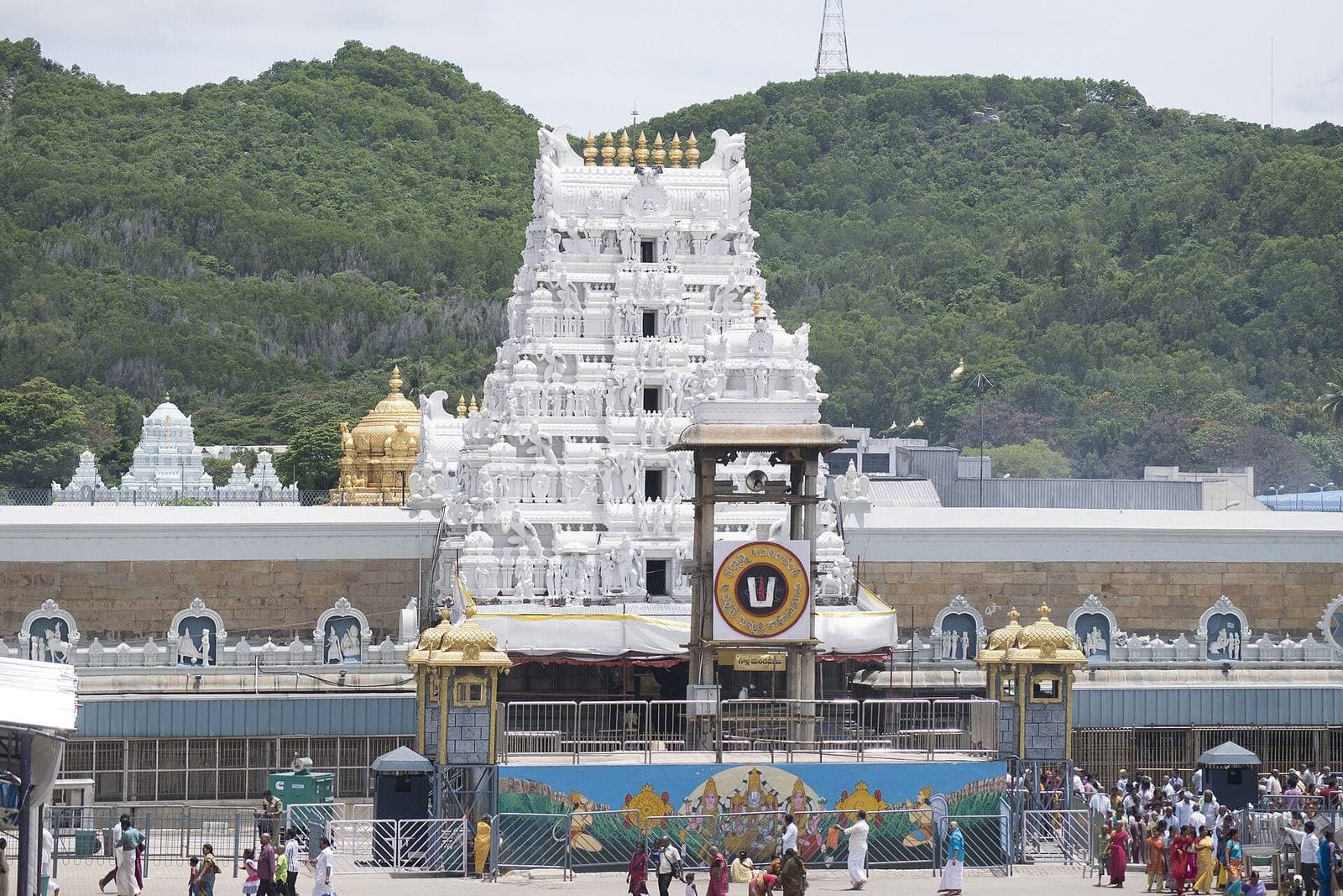 The gopuram of the Sri Venkateswara Temple at Tirumala, with green hills behind